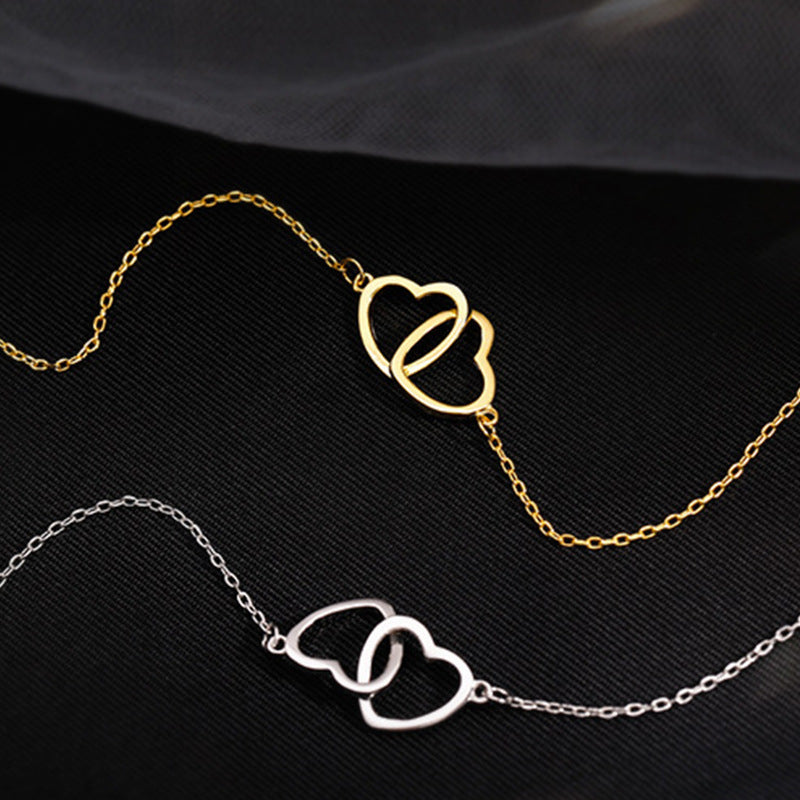 Doppelherz Halskette – Verschlungene Herzen | Gold & Silber