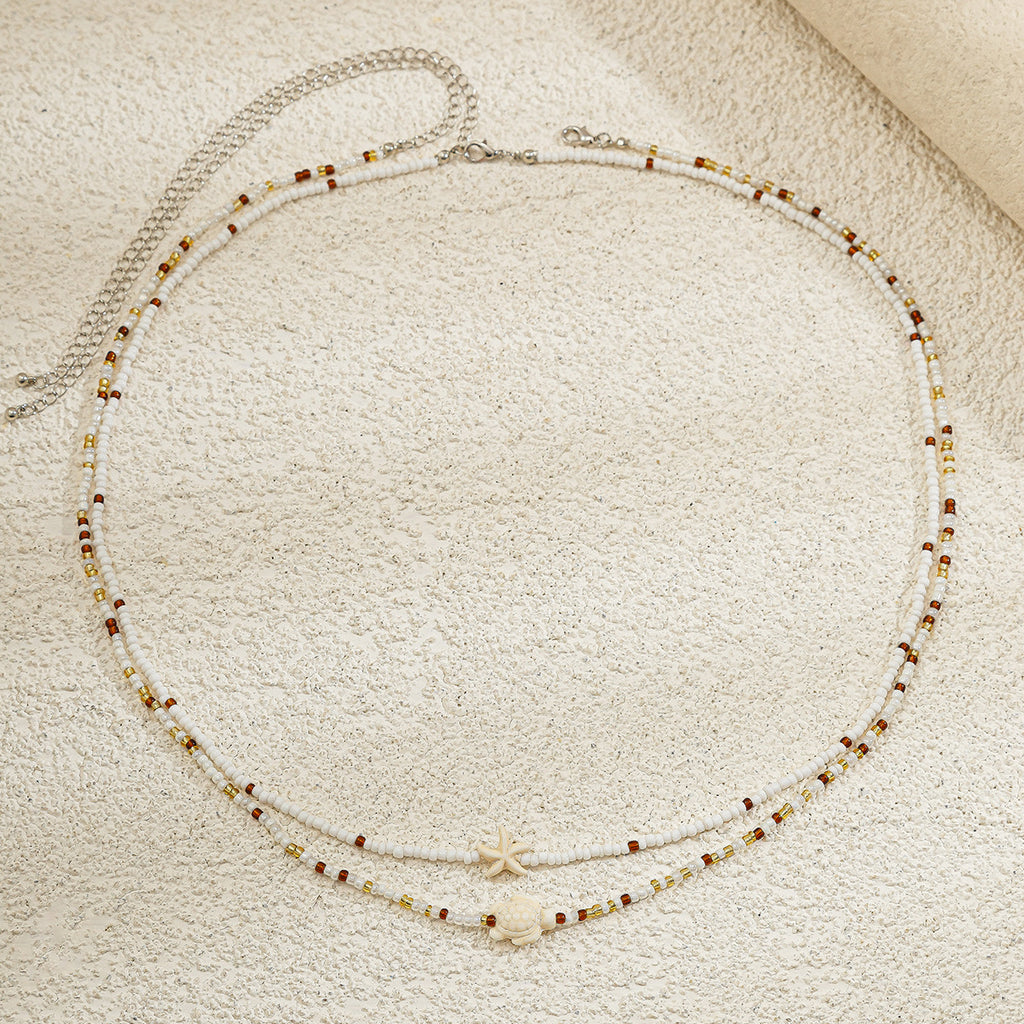 Ocean Wind Body Chain – Reisperlen Doppel-Taillenkette mit Seestern