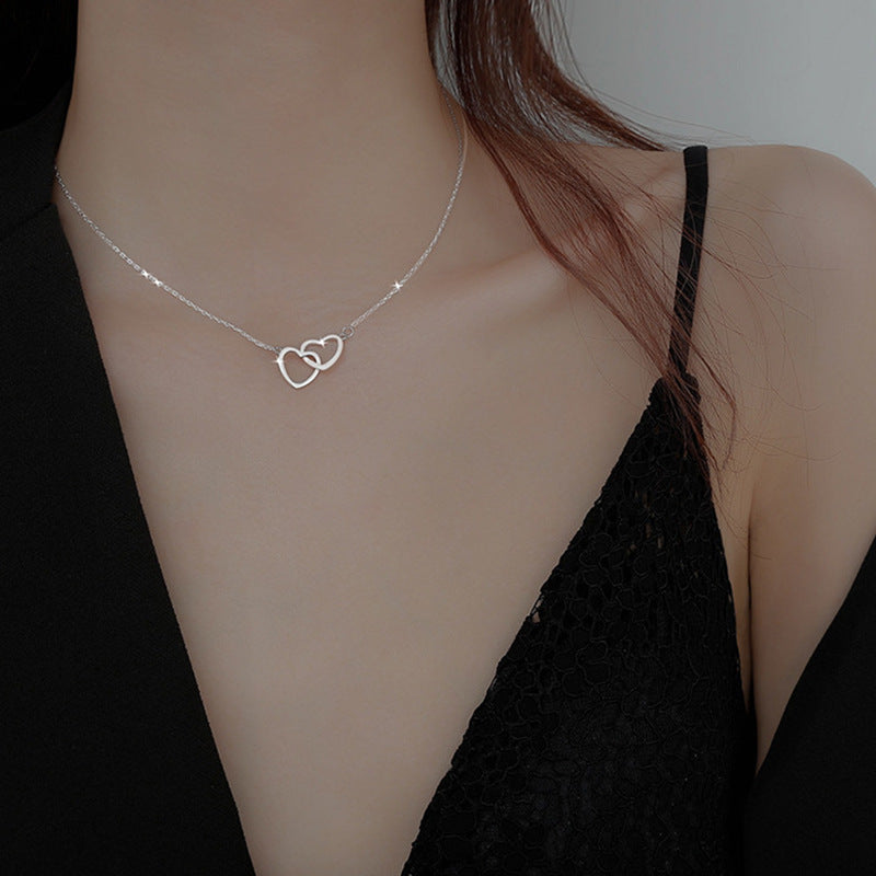 Doppelherz Halskette – Verschlungene Herzen | Gold & Silber