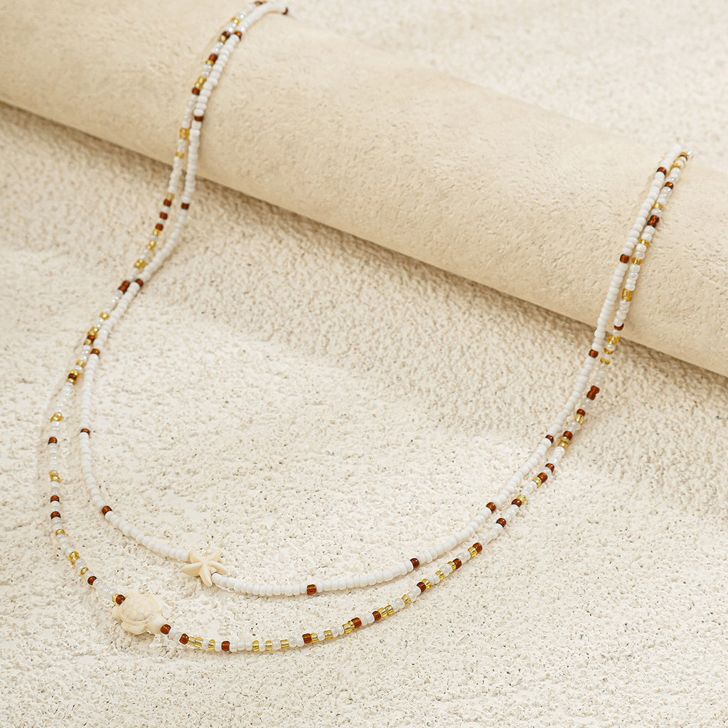 Ocean Wind Body Chain – Reisperlen Doppel-Taillenkette mit Seestern